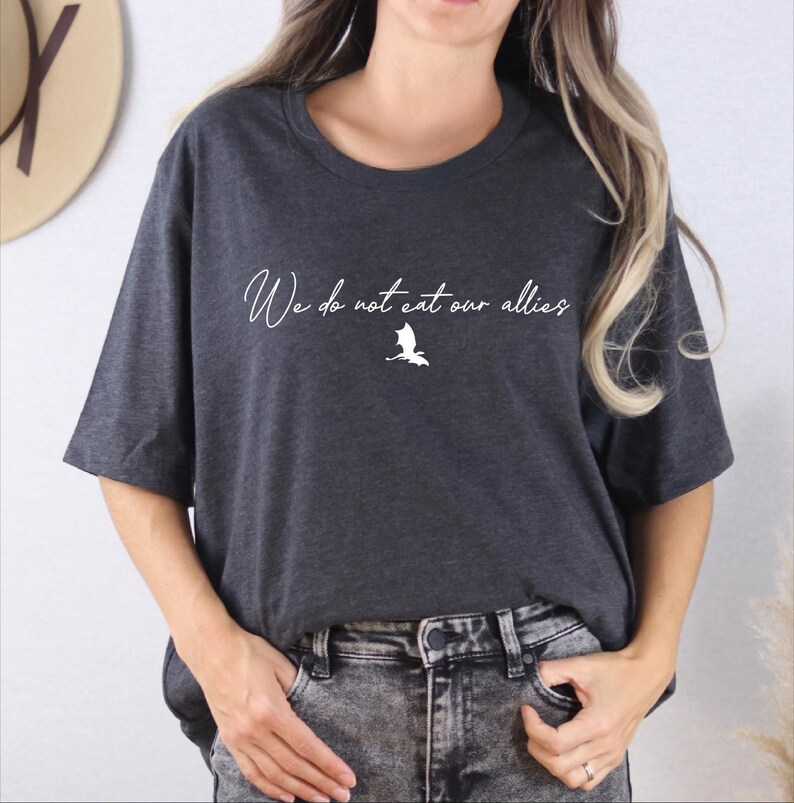 a woman wearing a t - shirt that says we're not too old