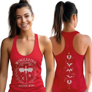 A smiling woman wearing a red tank top with a dragon design and text on it.