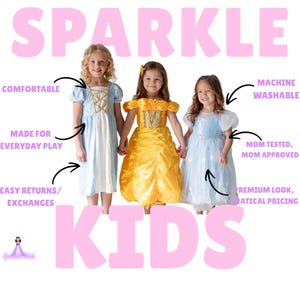 May include: Three young girls in princess dresses. The dresses are light blue, yellow, and light blue with white accents. The word "SPARKLE" is in pink letters above the girls, and the word "KIDS" is below them.