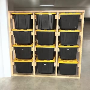 May include: A wooden storage shelf with 12 black storage bins with yellow lids. The shelf is made of unfinished wood and has a rustic look.