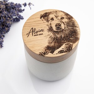 Concrete dog urn with oak lid and custom photo engraving.