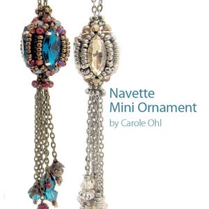 May include: Two beaded Navette Mini Ornaments with chain tassels. One has a teal blue oval crystal, the other a light amber crystal. The text "Navette Mini Ornament by Carole Ohl" is visible.