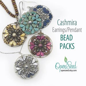 May include: A collection of beaded earrings and pendants in various colors, including teal, purple, and silver. The jewelry features a floral design with a central bead and a circular frame. The image also includes the text "Cashmira Earrings/Pendant BEAD PACKS."