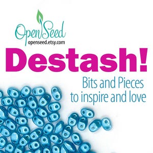May include: A collection of small, metallic blue, two-hole beads scattered at the bottom of the frame. The text reads OpenSeed openseed.etsy.com, Destash!, and Bits and Pieces to inspire and love, set against a plain white background.
