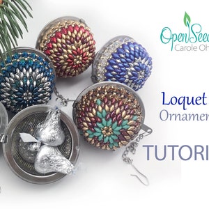 May include: Four beaded ornaments in various colors, including red, blue, green, and gold, are displayed in a tea infuser. The ornaments are made with small beads and have a spherical shape. The text "Loquet 1 Ornament TUTORIAL" is visible in the image.