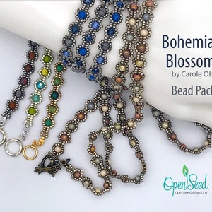 May include: A set of five beaded bracelets in various colors, including green, blue, brown, and silver. The bracelets are made with small, round beads and feature a flower-shaped design. The bracelets are labeled "Bohemian Blossom Bead Pack" by Carole Ohl.