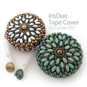 May include: Two beaded tape measure covers, one with silver and gold beads and the other with green and brown beads. The covers are labelled "IrisDuo Tape Cover by Carole Ohl".