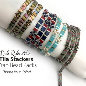 May include: A collection of multi-colored Tila bead wrap bracelets featuring rectangular tiles and small round accent beads in metallic, blue, red, turquoise, and green tones. The text reads: Deb Roberti's Tila Stackers Wrap Bead Packs Choose Your Color!