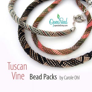 May include: Three beaded necklaces in black, pink, and green with a silver clasp. The necklaces are called "Tuscan Vine Bead Packs" by Carole Ohl.