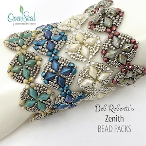 May include: Close-up of beaded bracelets in various colors, including teal, white, and deep blue. The bracelets feature square and circular designs with intricate beadwork. The text "Deb Roberti's Zenith BEAD PACKS" is visible.