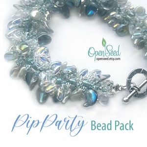 May include: A bracelet made of iridescent blue, gray, and clear teardrop-shaped beads with a silver toggle clasp. The text OpenSeed openseed.etsy.com and PipParty Bead Pack is visible. The beads are arranged in a dense, textured cluster pattern.