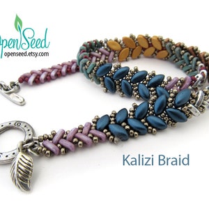 May include: A multi-colored beaded bracelet with a silver clasp and a leaf charm. The bracelet is made with a variety of seed beads in shades of blue, green, brown, and pink. The bracelet is called "Kalizi Braid".