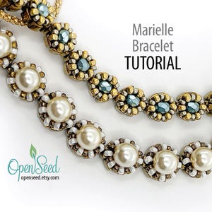 May include: Two beaded bracelets, one with white pearls and one with blue and gold beads. The bracelet with pearls is in the foreground and the bracelet with blue and gold beads is in the background. The text "Marielle Bracelet TUTORIAL" is visible above the bracelets.