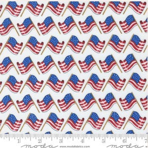 May include: White fabric patterned with repeating American flags. Each flag features a blue field with white stars and red and white stripes, set on a gold pole. The flags are arranged in a grid pattern.