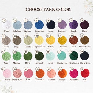 May include: A color chart titled CHOOSE YARN COLOR featuring 32 numbered circular yarn samples in various shades including white, blues, purples, browns, greens, pinks, and reds, each labeled with its corresponding color name below the circle.