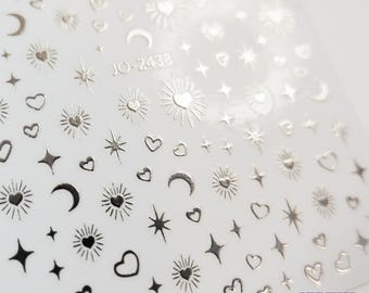 Pegatinas de uñas 5D con estrellas, lunas y corazones: autoadhesivas doradas y plateadas para manualidades.