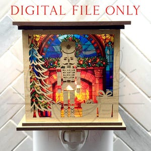 May include: A wooden Christmas night light with a laser-cut design featuring a nutcracker soldier, Christmas tree, and gifts. The background shows a stained-glass window and a fireplace. The text "DIGITAL FILE ONLY" is at the top.