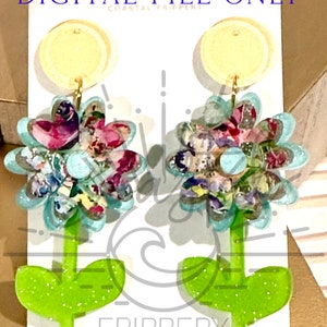 May include: A pair of floral earrings with a light blue and pink flower design. The earrings have a green stem and leaves. The earrings are on a white background with the text "DIGITAL FILE ONLY" and "COASTAL FRIPPERY".