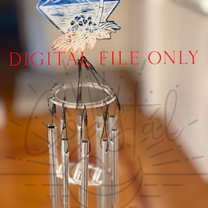 May include: A silver wind chime with a decorative top featuring a blue and white image of a palm tree and a crescent moon. The text "DIGITAL FILE ONLY" is visible in red at the top of the image.