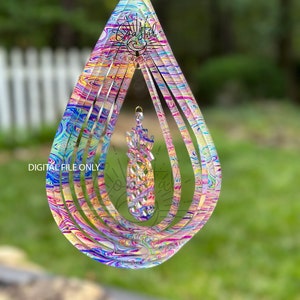 May include: A colorful, multi-layered, teardrop-shaped wind spinner with a swirling, marbled pattern. The wind spinner is made of clear acrylic and has a silver metal top.