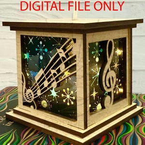 May include: A wooden lantern with a dark brown top and base, featuring cut-out musical notes and a treble clef. The lantern's interior is illuminated with lights, and the text "DIGITAL FILE ONLY" is visible at the top.