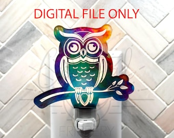 May include: A colorful owl nightlight with a watercolor effect. The owl is perched on a branch with leaves. The nightlight is plugged into an outlet.
