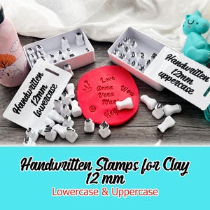 May include: Handwritten stamps for clay, including 12mm lowercase and uppercase letters. The image shows white stamp heads with black lettering, arranged in boxes and scattered around a red clay circle with stamped words. The text "Handwritten Stamps for Clay" is also visible.