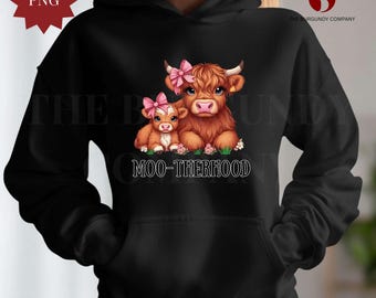 May include: Black hoodie with a graphic of a brown cow and a calf with pink bows. The text "Moo-therhood" is printed below the cows.