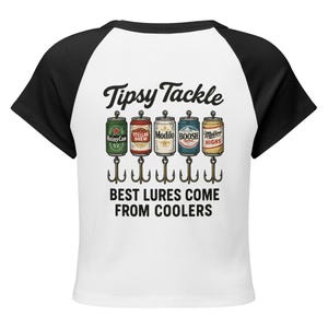 May include: White and black raglan crop top with the text "Tipsy Tackle". The graphic features beer cans with fishing hooks and the text "Best Lures Come From Coolers".