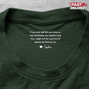 May include: Dark green t-shirt with white text: "If you ever feel like you have no one, remember you always have me. I might not be much but I'll always be here for you." Includes a heart and the name "Sophia".