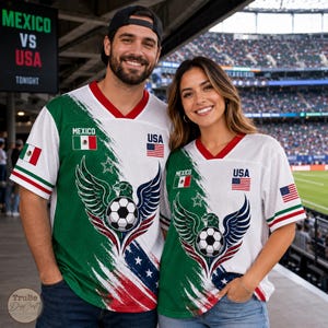 May include: Two white mesh football jerseys featuring a diagonal split design with green and red accents. Each jersey displays the text MEXICO and USA, national flags, a central football graphic with eagle wings, and a small star icon.