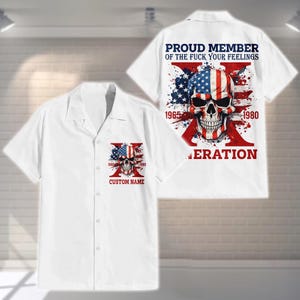 May include: White button-up shirt with a skull design. The skull is decorated with the American flag and the text "PROUD MEMBER OF THE FUCK YOUR FEELINGS" on the back. The front pocket has a similar design with the text "CUSTOM NAME".