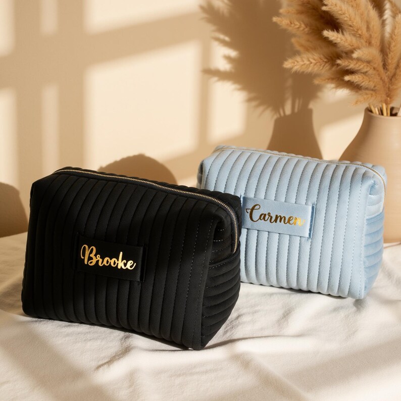 a couple of bags sitting on top of a bed