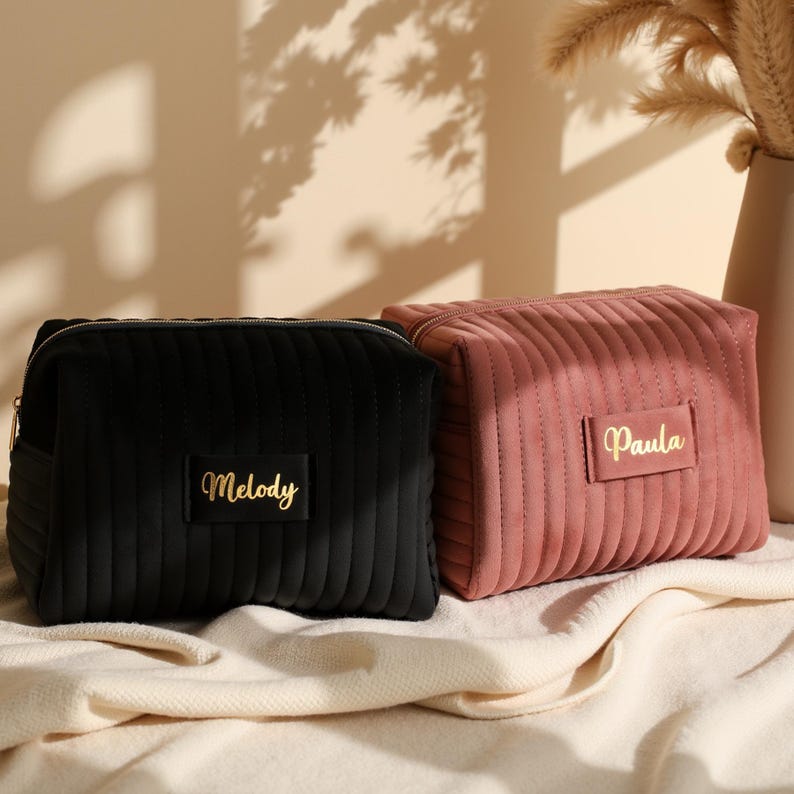 a couple of bags sitting on top of a bed