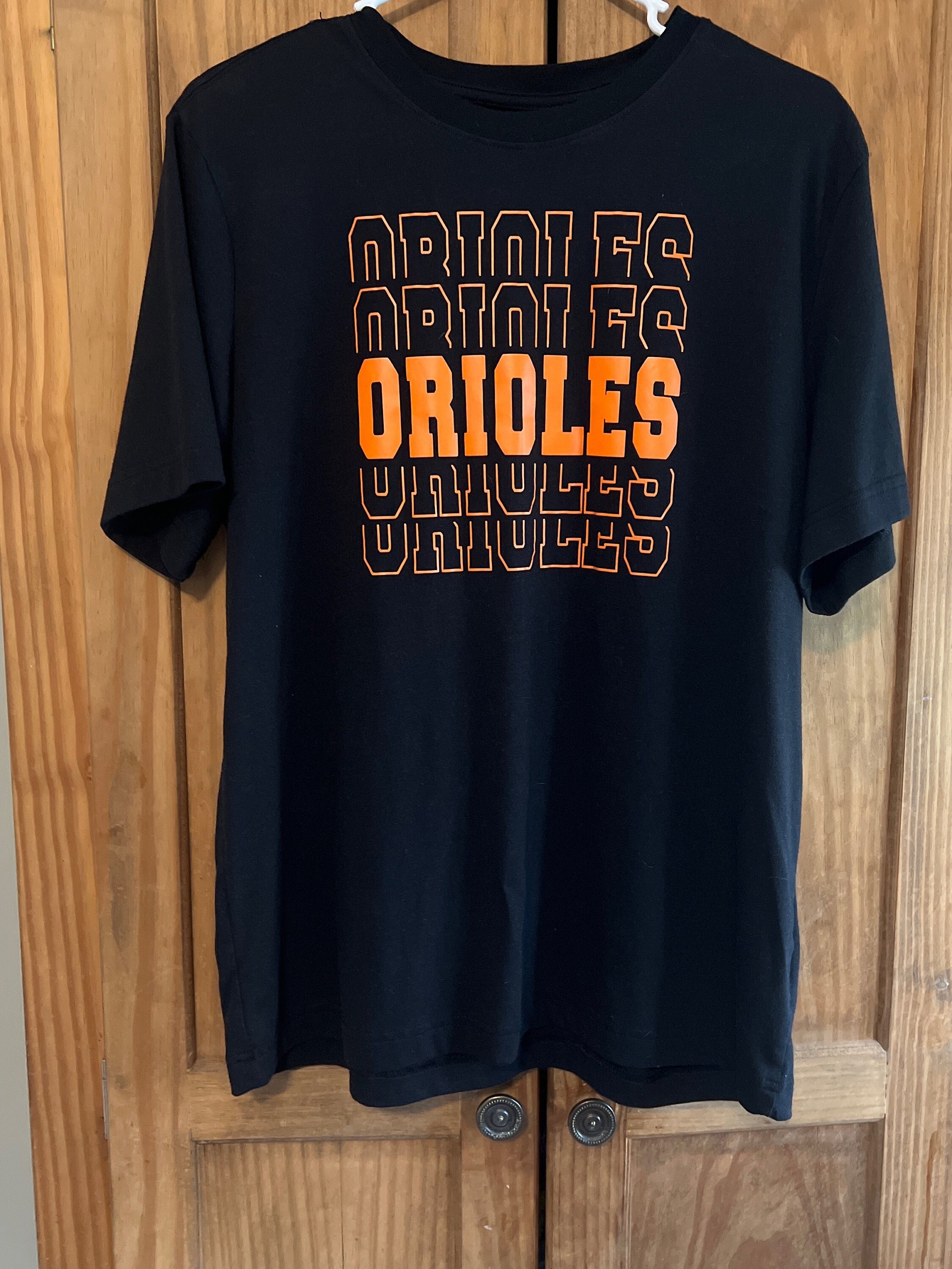 deadmansupplyco Vintage Running Baseball Player - Baltimore Orioles (Orange Orioles Wordmark) T-Shirt