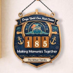 May include: Wooden wall hanging with the text "Days Until Our Next Cruise" and "Making Memories Together." The sign features a ship, anchors, and the number "185" on a blue background. Includes a personalized nameplate.