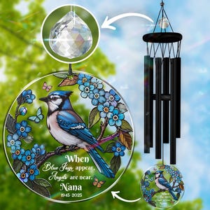 May include: A blue jay wind chime with a crystal prism and a round glass panel featuring a blue jay, forget-me-not flowers, and the text "When Blue Jays appear, Angels are near. Nana 1945-2025".