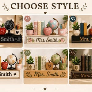 May include: A collection of six personalized desk organizers labeled 'Mrs. Smith', each featuring a small potted plant, three miniature books, a decorative apple, a globe, and a pencil holder. The sets vary in color, including black, white, and wood tones.
