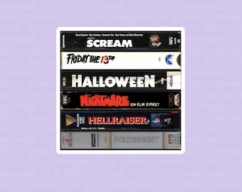 May include: A waterproof vinyl sticker featuring a stack of VHS tapes with horror movie titles like "Scream," "Friday the 13th," and "Halloween." The sticker has a white border and a purple background.
