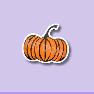 May include: Orange pumpkin sticker with black vertical lines and a curved stem. The sticker has a white border and the text "Miss Spooky" is visible on the pumpkin. The words "Waterproof Vinyl Stickers" are at the bottom.