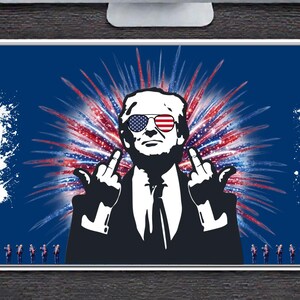 May include: A rectangular desk mat with a blue background featuring a graphic of a person wearing sunglasses with an American flag design. The person is giving the middle finger. The numbers "45" and "47" are on either side.