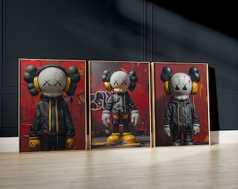 May include: Three framed art prints featuring a cartoon character with a black and white face, wearing a black jacket and headphones. The character is standing on a red and yellow background with graffiti.