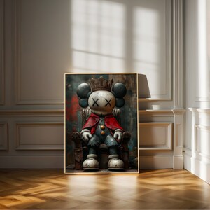 May include: A digital art print of a cartoon character wearing a crown and sitting on a throne. The character has a red cape and a blue and white outfit. The background is a dark, textured surface.