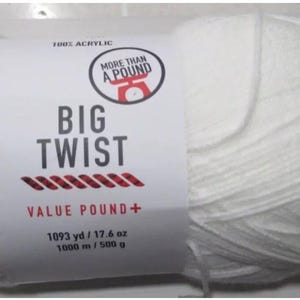 May include: A large, white ball of Big Twist yarn. The label reads "100% Acrylic" and "More Than A Pound." The label also states "Value Pound+" and lists the yardage as 1093 yd / 17.6 oz, and 1000 m / 500 g. The yarn is suitable for knitting and crochet projects.