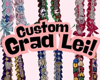 May include: A collection of custom graduation leis in various colors, including pink, blue, purple, and gold. Each lei features personalized text, character designs, and the graduation year. The image includes the text "Custom Grad Lei!"