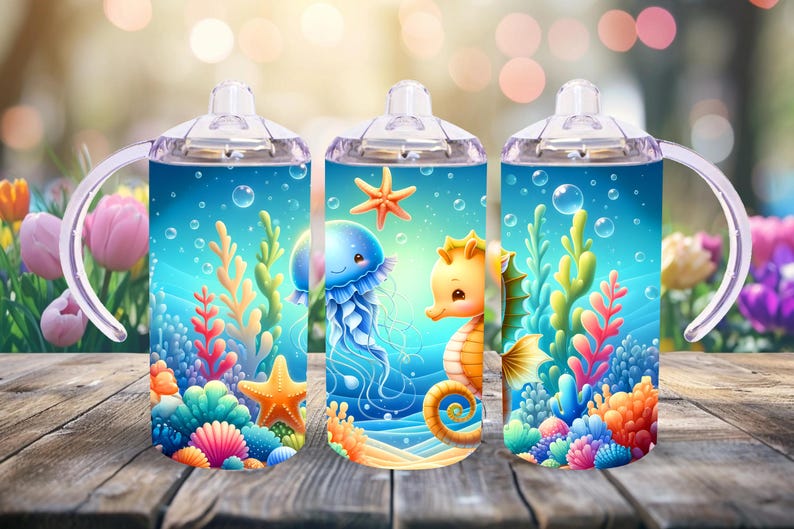 May include: Three stainless steel tumblers with clear lids and handles. Each tumbler features a different underwater scene with a seahorse, a jellyfish, and coral reefs. The tumblers are a light blue color with a white background.