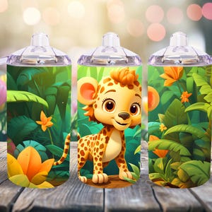 May include: Three stainless steel tumblers with a jungle theme. Each tumbler features a cartoon cheetah with green leaves and flowers. The tumblers have clear plastic lids and handles.