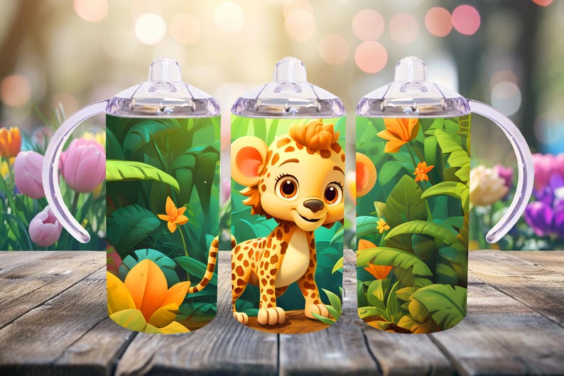May include: Three stainless steel tumblers with a jungle theme. Each tumbler features a cartoon cheetah with green leaves and flowers. The tumblers have clear plastic lids and handles.