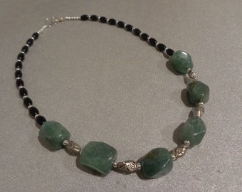Green glass, black and silver necklace. 18 1/2" long