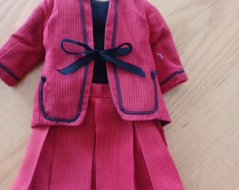 Vintage brick red doll jacket and pleated skirt.